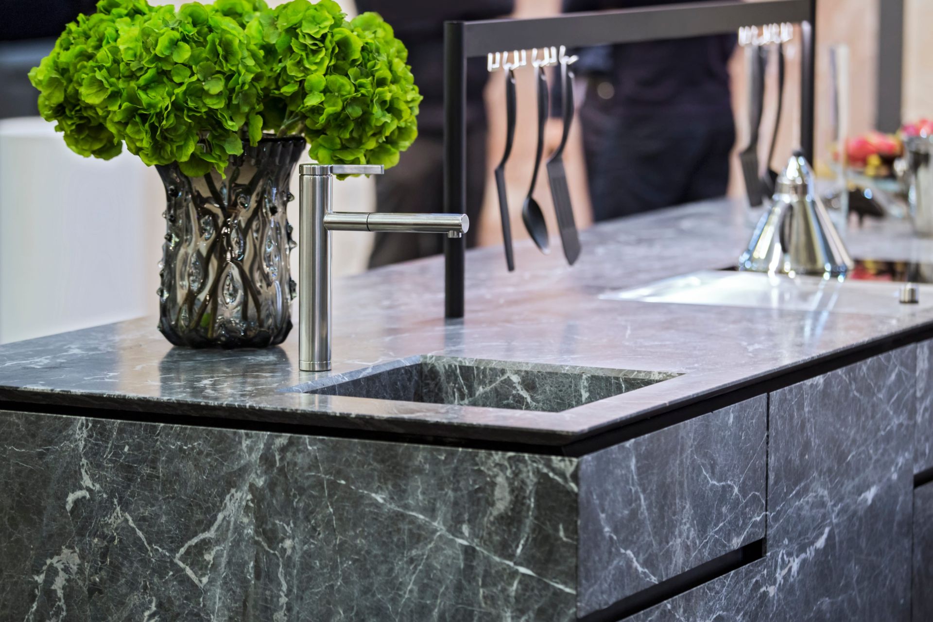 Dark stone benchtops in kitchen